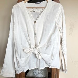 White gauzy top. Swing style.